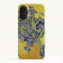 Vase With Irises Against A Yellow Background