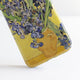 Vase With Irises Against A Yellow Background